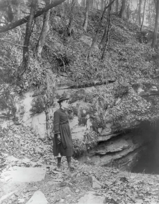 Framed Print : Frances Benjamin Johnston, full, standing by wooded cliff at entrance to Mammoth Cave, (c1891?). Creator: Frances Benjamin Johnston Framed Print : Frances Benjamin Johnston, full, standing by wooded cliff at entrance to Mammoth Cave, (c1891?). Creator: Frances Benjamin Johnston
