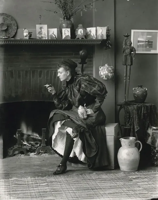 Framed Print : Frances Benjamin Johnston, full-length portrait, seated in front of fireplace, facing left... 1896. Creator: Frances Benjamin Johnston Framed Print : Frances Benjamin Johnston, full-length portrait, seated in front of fireplace, facing left... 1896. Creator: Frances Benjamin Johnston