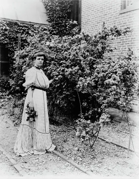 Framed Print : Frances Benjamin Johnston, full-length portrait, standing in her garden... c1890 - 1910. Creator: Unknown Framed Print : Frances Benjamin Johnston, full-length portrait, standing in her garden... c1890 - 1910. Creator: Unknown