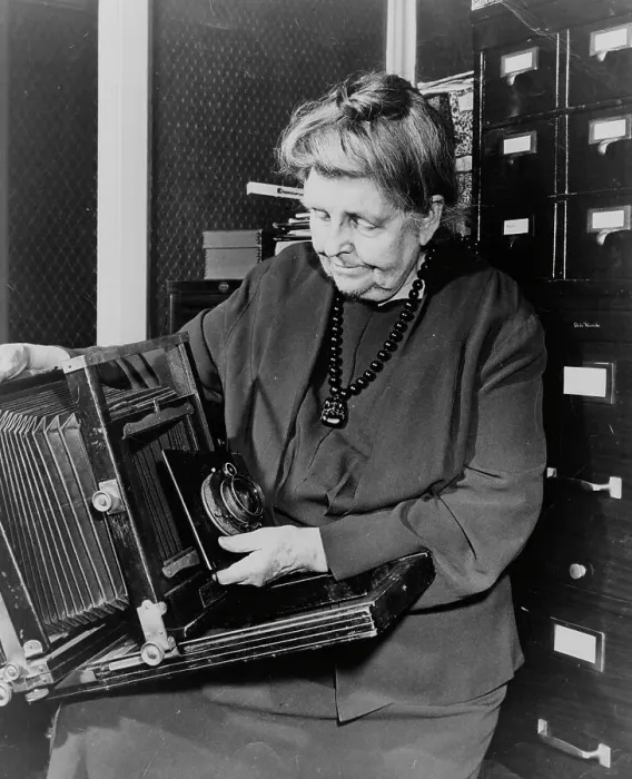 Framed Print : Frances Benjamin Johnston, three-quarter length portrait, holding and looking down... c1950. Creator: Unknown Framed Print : Frances Benjamin Johnston, three-quarter length portrait, holding and looking down... c1950. Creator: Unknown
