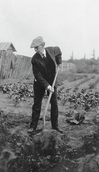 Frank G. Carpenter in a garden, between c1900 and 1916. Creator: Unknown