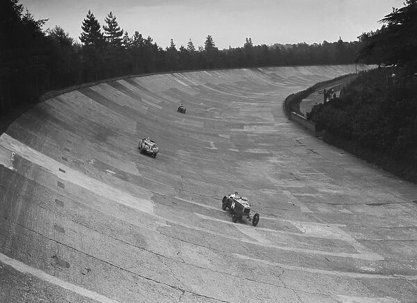 Frazer-Nash and Frazer-Nash BMW racing on the banking at Brooklands, 1938 or 1939