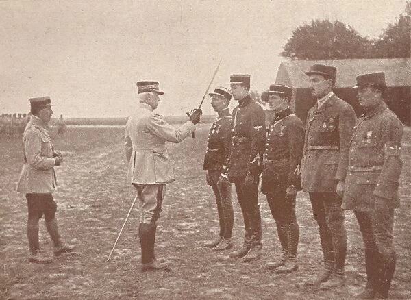 A French General conferring decorations on aviators, c1918 (1919)