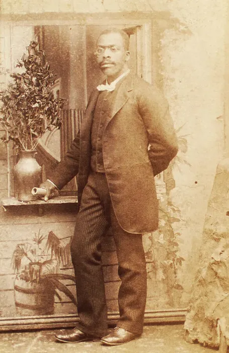 Framed Print : Full-length portrait of man, with studio props, c1880-c1889. Creator: Richmond Photograph Co Framed Print : Full-length portrait of man, with studio props, c1880-c1889. Creator: Richmond Photograph Co