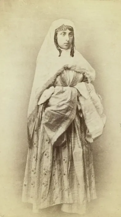 Framed Print : Full-length portrait of a woman, facing slightly right, in traditional dress, between 1870 and 1886. Creator: Unknown Framed Print : Full-length portrait of a woman, facing slightly right, in traditional dress, between 1870 and 1886. Creator: Unknown