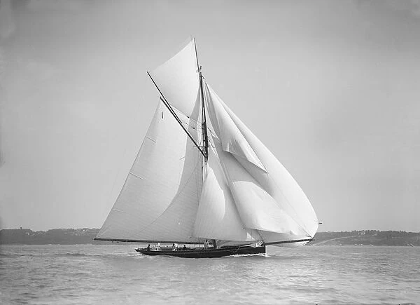 The gaff rigged cutter Bloodhound sailing downwind with spinnaker, 1911. Creator