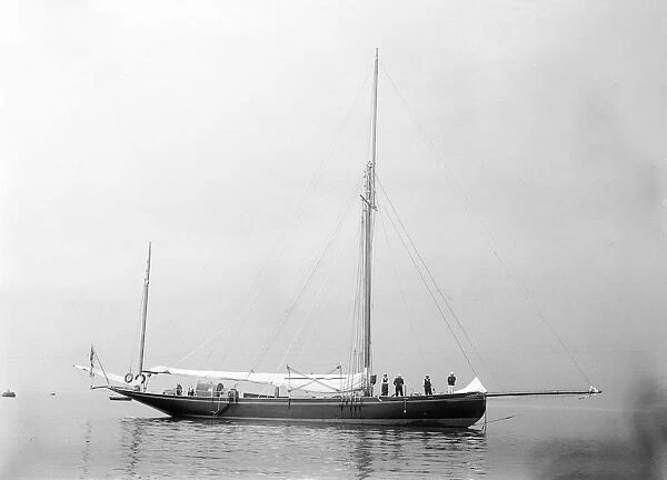 The gaff yawl Coral at anchor, 1922. Creator: Kirk & Sons of Cowes