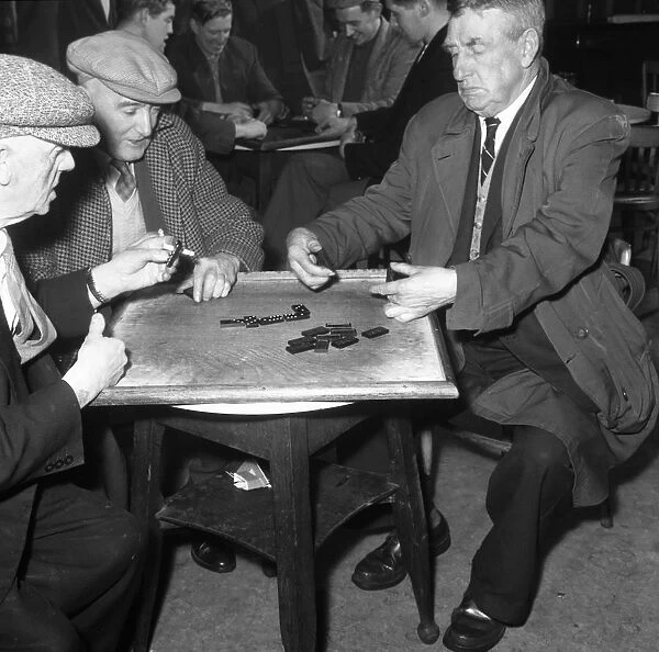 A game of dominoes in a miners welfare club, Horden, County Durham, 1963. Artist