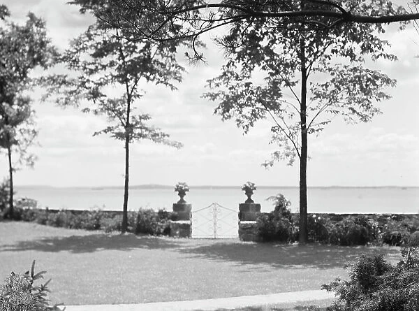 Garden overlooking water, East Hampton, Long Island, between 1933 and 1942. Creator: Arnold Genthe