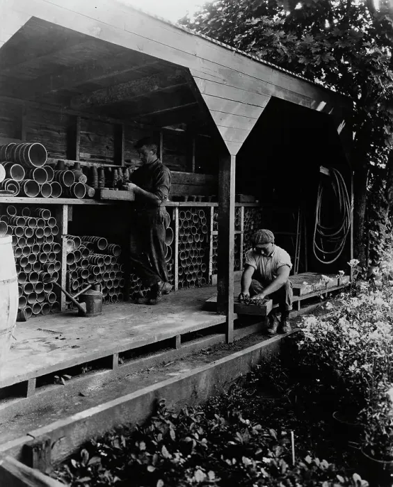 Framed Print : Gardeners potting plants in a shed, posed to...Rudyard Kipling's poem The Glory of the Garden, 1917. Creator: Frances Benjamin Johnston Framed Print : Gardeners potting plants in a shed, posed to...Rudyard Kipling's poem The Glory of the Garden, 1917. Creator: Frances Benjamin Johnston