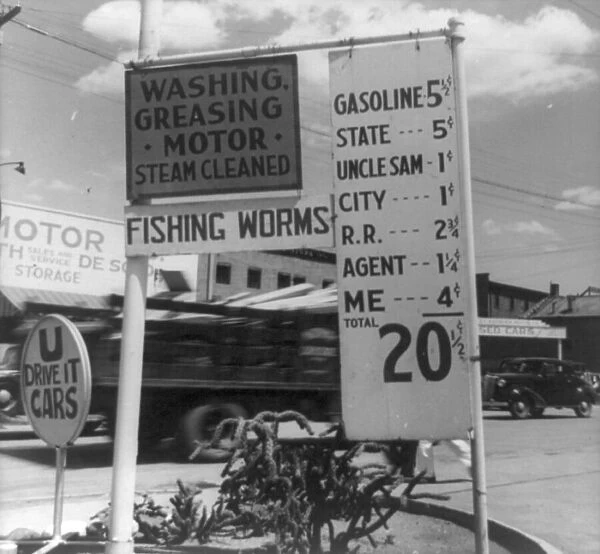 Gas station price analysis, Santa Fe, New Mexico, 1938. Creator: Dorothea Lange