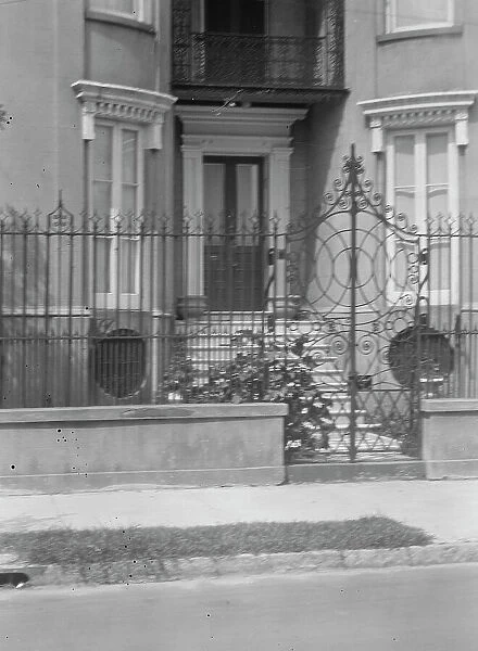 Gate and doorway of a multi-story house, [The James Simmons House, 37 Meeting Street]... c1920-1926 Creator: Arnold Genthe