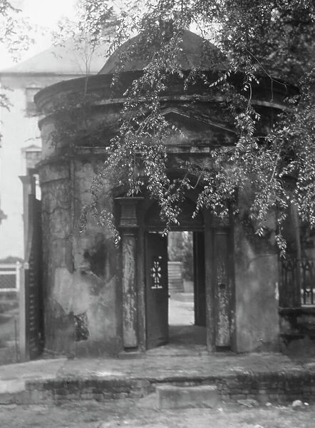 Gatehouse in front of the Joseph Manigault House, 350 Meeting Street, Charleston... c1920-c1926. Creator: Arnold Genthe