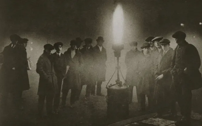 Framed Print : Gathering around an acetylene flare at a traffic control point in the fog, early 20th century Framed Print : Gathering around an acetylene flare at a traffic control point in the fog, early 20th century