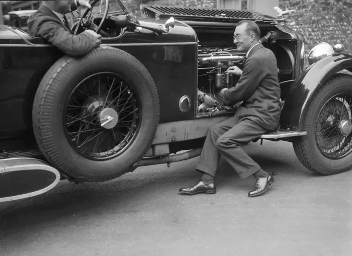 Framed Print : Geoffrey Baker inspecting the engine of a Minerva car. Artist: Bill Brunell Framed Print : Geoffrey Baker inspecting the engine of a Minerva car. Artist: Bill Brunell