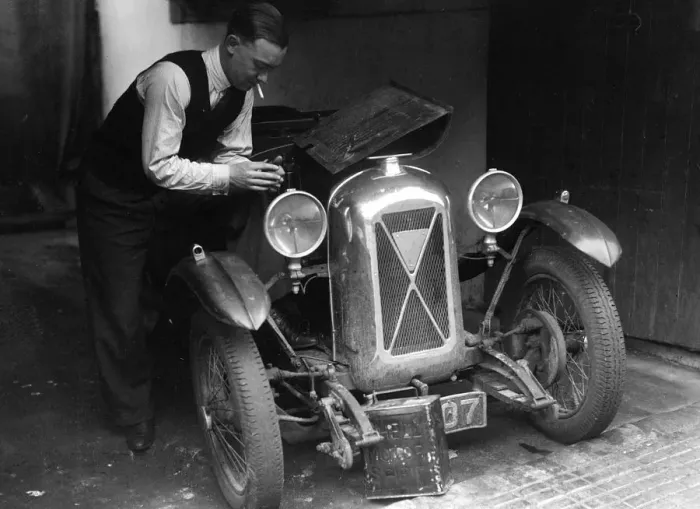 Framed Print : Geoffrey Baker working on a Salmson 1090cc car. Artist: Bill Brunell Framed Print : Geoffrey Baker working on a Salmson 1090cc car. Artist: Bill Brunell