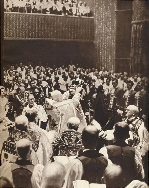 George VI is crowned with St. Edwards Crown on the day of his coronation, 1937