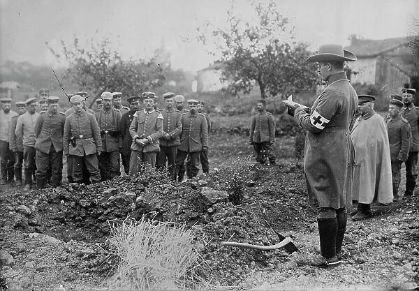 German Field chaplain burying French Officer who died in hospital, 1914. Creator: Bain News Service