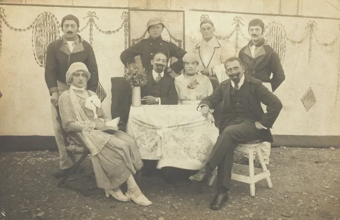 Framed Print : German soldiers, some in drag, pose round a table at a concert party, (between 1910 and 1919?). Creator: Unknown Framed Print : German soldiers, some in drag, pose round a table at a concert party, (between 1910 and 1919?). Creator: Unknown
