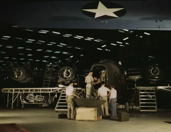 Framed Print : Getting a nose door ready to put on a C-87... Consolidated Aircraft Corp... Fort Worth, Texas, 1942. Creator: Howard Hollem Framed Print : Getting a nose door ready to put on a C-87... Consolidated Aircraft Corp... Fort Worth, Texas, 1942. Creator: Howard Hollem