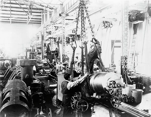 Getting ready to hoist a mounted gun, in Washington Navy Yard(?), 1903. Creator: Frances Benjamin Johnston