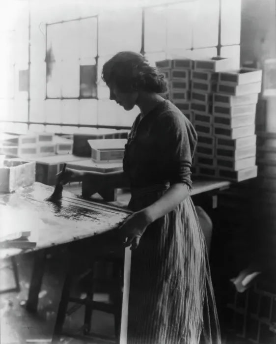 Framed Print : Girl painting strips with glue to assemble cigar boxes, c1910. Creator: Frances Benjamin Johnston Framed Print : Girl painting strips with glue to assemble cigar boxes, c1910. Creator: Frances Benjamin Johnston