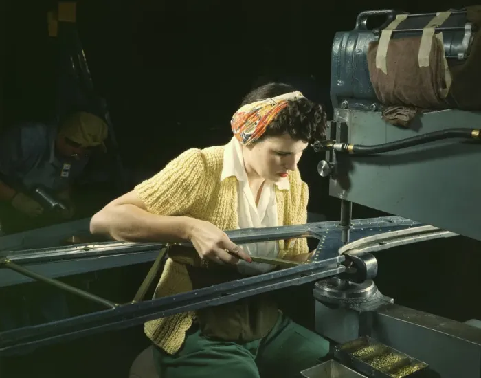 Framed Print : A girl riveting machine operator at the Douglas Aircraft Company plant... Long Beach, Calif. 1942 Creator: Alfred T Palmer Framed Print : A girl riveting machine operator at the Douglas Aircraft Company plant... Long Beach, Calif. 1942 Creator: Alfred T Palmer