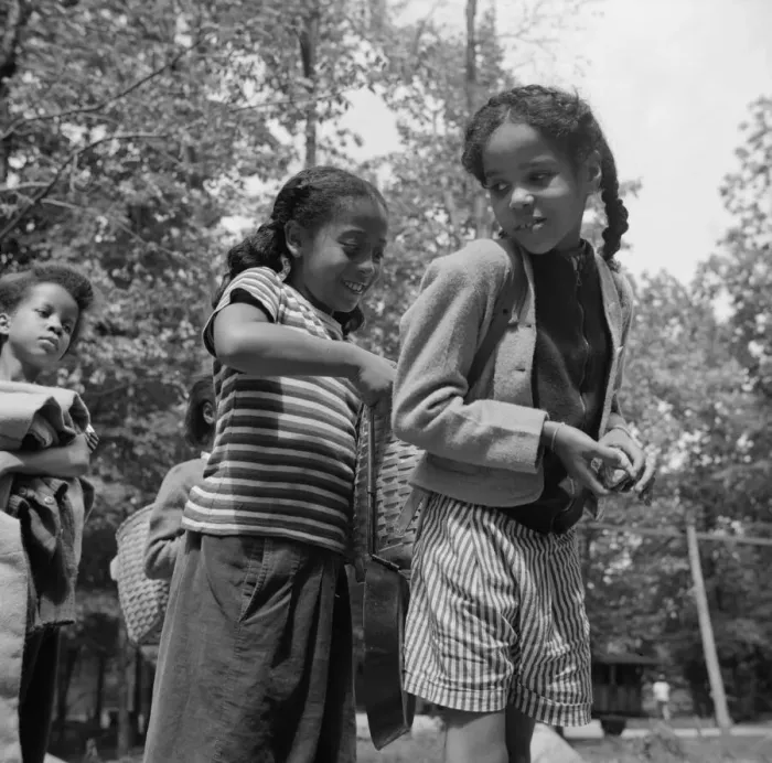 Framed Print : Girls adjusting each others packs for a hike at Camp Fern Rock, Bear Mountain, New York, 1943. Creator: Gordon Parks Framed Print : Girls adjusting each others packs for a hike at Camp Fern Rock, Bear Mountain, New York, 1943. Creator: Gordon Parks