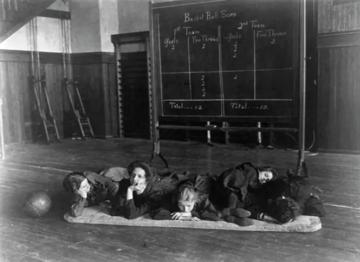 Framed Print : Five girls lying on mat in gymnasium in front of basketball scoreboard... Washington, D.C. (1899?) Creator: Frances Benjamin Johnston Framed Print : Five girls lying on mat in gymnasium in front of basketball scoreboard... Washington, D.C. (1899?) Creator: Frances Benjamin Johnston