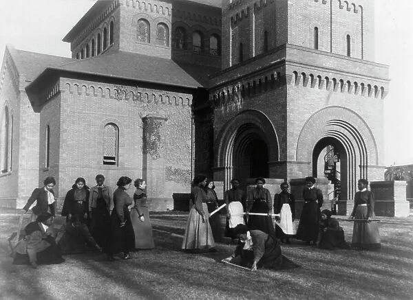 Girls measuring piece of ground in arithmetic class at Hampton Institute, Hampton, Va. 1899 or 1900 Creator: Frances Benjamin Johnston