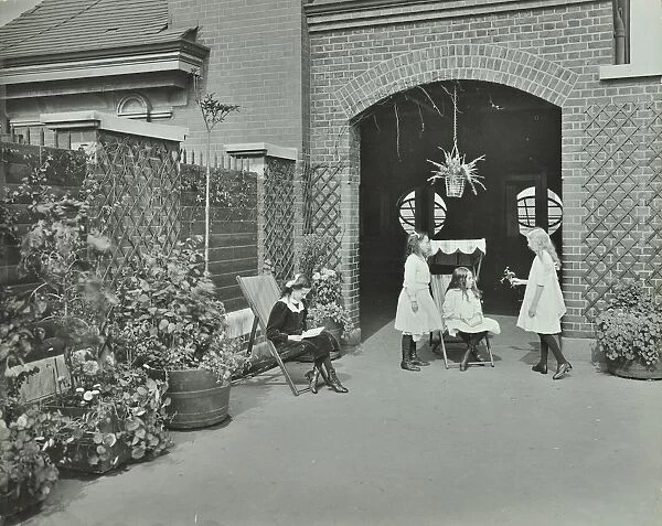 Girls relaxing in a roof top garden, White Lion Street School, London, 1912