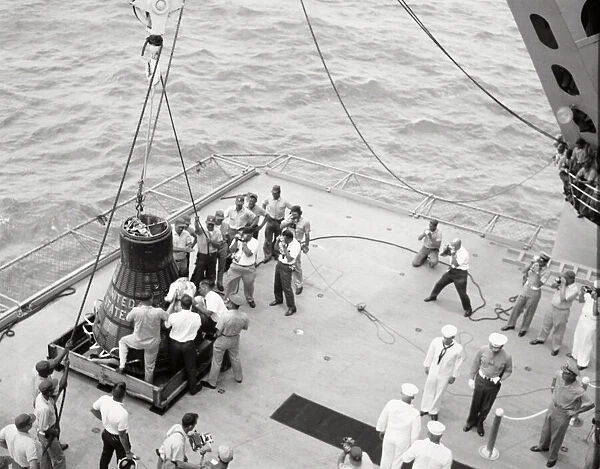 Gordon Cooper and capsule on deck, Pacific Ocean, 1963. Creator: NASA