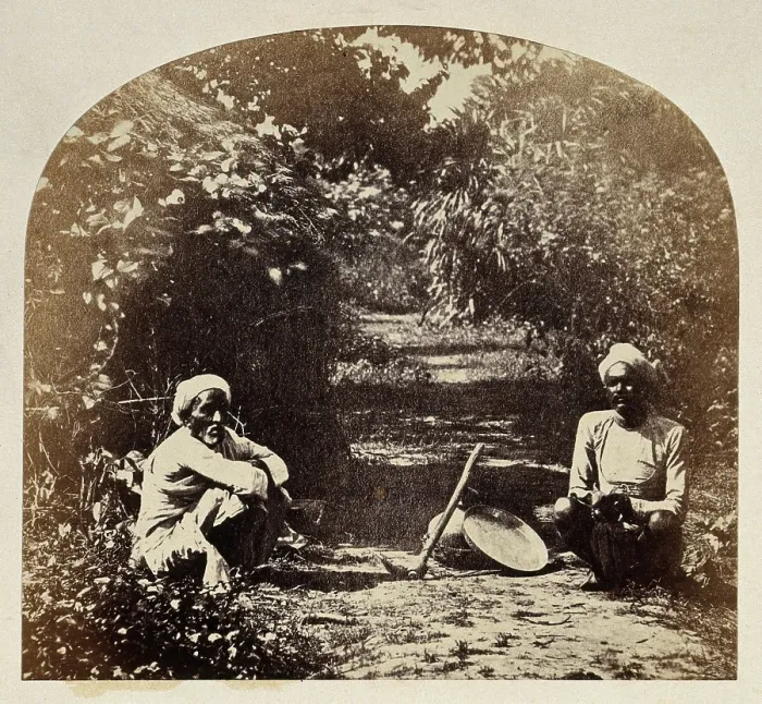 Framed Print : Goruckpoor, India: two men sqatting on a tree-lined path, c1860s. Creator: Unknown Framed Print : Goruckpoor, India: two men sqatting on a tree-lined path, c1860s. Creator: Unknown
