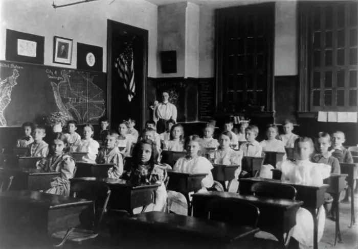 Framed Print : Grade school children posed in classroom, with teacher standing in back... Washington DC, (1899?). Creator: Frances Benjamin Johnston Framed Print : Grade school children posed in classroom, with teacher standing in back... Washington DC, (1899?). Creator: Frances Benjamin Johnston