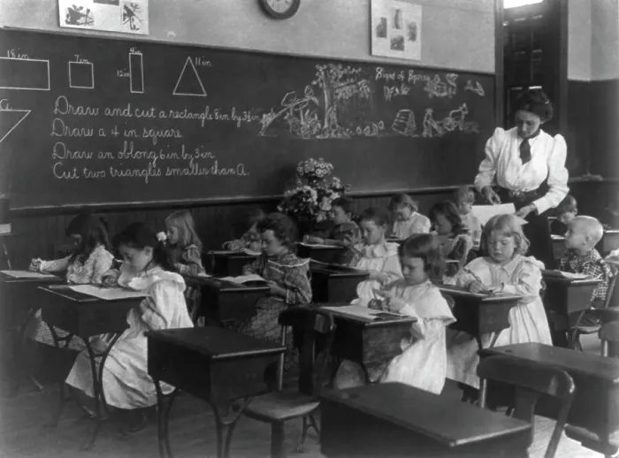 Framed Print : Grade school, Washington, D.C. - children drawing and cutting rectangles, triangles, etc. (1899?). Creator: Frances Benjamin Johnston Framed Print : Grade school, Washington, D.C. - children drawing and cutting rectangles, triangles, etc. (1899?). Creator: Frances Benjamin Johnston