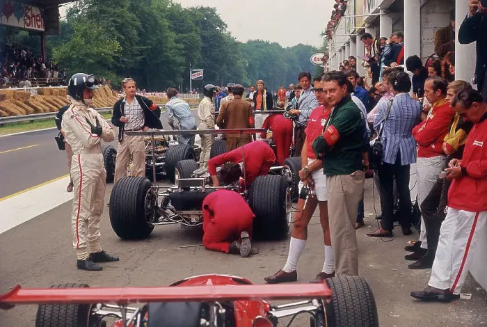 Framed Print : Graham Hill watches Mechanics working on a car, French Grand Prix, Rouen, 1968 Framed Print : Graham Hill watches Mechanics working on a car, French Grand Prix, Rouen, 1968