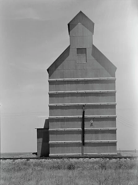 Grain elevator on the Texas Panhandle plains, Everett, Texas, 1938. Creator: Dorothea Lange