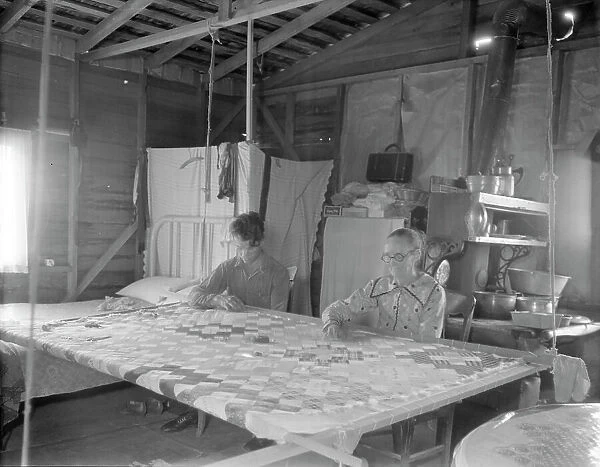 Grandmother from Oklahoma with grandson, working on quilt, California, Kern County, 1936. Creator: Dorothea Lange
