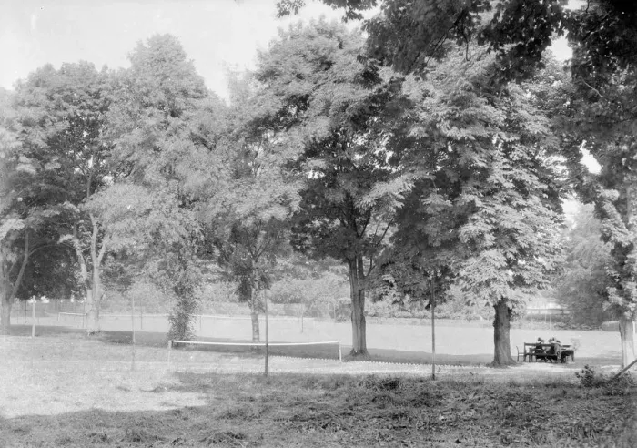 Framed Print : Grass tennis court among trees, c1935. Creator: Kirk & Sons of Cowes Framed Print : Grass tennis court among trees, c1935. Creator: Kirk & Sons of Cowes