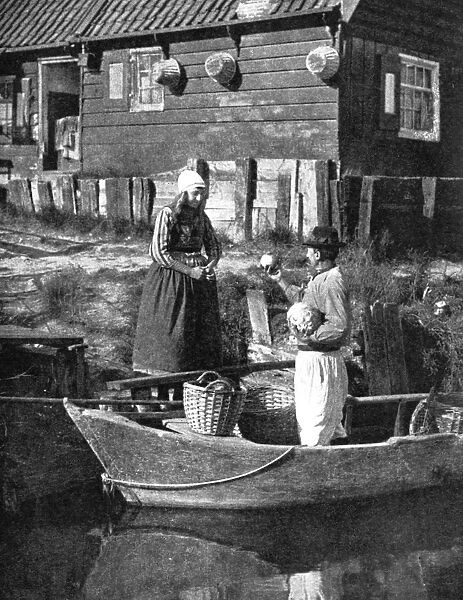 Greengrocer bringing goods by boat, Marken, Holland, 1936. Artist: Donald McLeish
