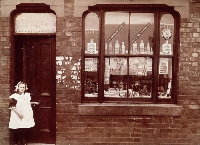 Framed Print : A grocer's shop in England: doorway and shop window, (1900?). Creator: Unknown. A grocer's shop in England: doorway and shop window, (1900?). Creator: Unknown Framed Print : A grocer's shop in England: doorway and shop window, (1900?). Creator: Unknown. A grocer's shop in England: doorway and shop window, (1900?). Creator: Unknown