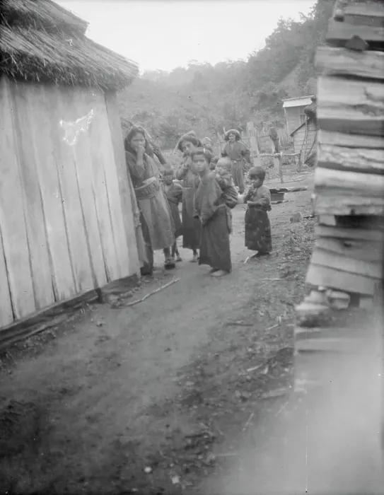 Framed Print : Group of Ainu children standing in a passageway between huts, 1908. Creator: Arnold Genthe Framed Print : Group of Ainu children standing in a passageway between huts, 1908. Creator: Arnold Genthe