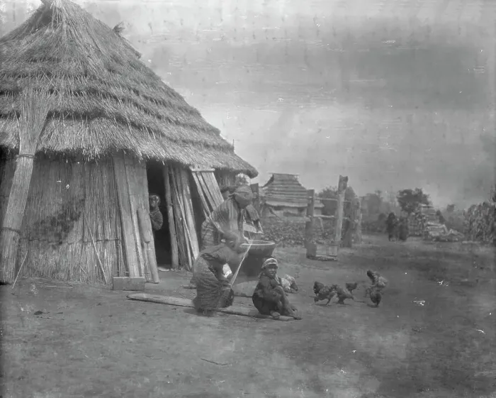 Framed Print : Group of Ainu outside a hut, 1908. Creator: Arnold Genthe Framed Print : Group of Ainu outside a hut, 1908. Creator: Arnold Genthe