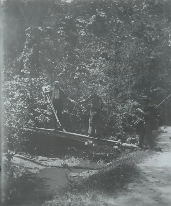 Framed Print : Group crossing footbridge with cameras, between 1885 and 1900. Creator: Frances Benjamin Johnston Framed Print : Group crossing footbridge with cameras, between 1885 and 1900. Creator: Frances Benjamin Johnston