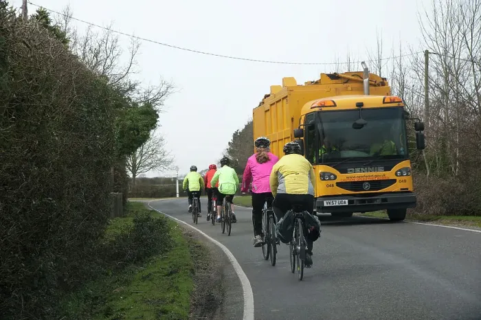 Framed Print : Group of cylists encounter refuse truck on country road in New Forest 2014 Framed Print : Group of cylists encounter refuse truck on country road in New Forest 2014