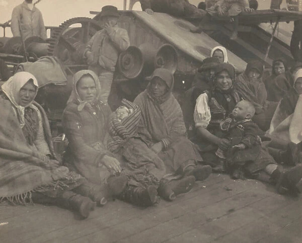 Group of emigrants (women and children) from eastern Europe on deck of the S.S. Amsterdam, 1899. Creator: Frances Benjamin Johnston