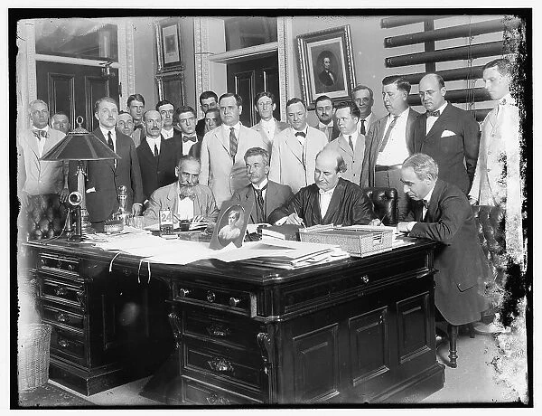 Group: includes William Jennings Bryan (at desk, 2nd from right)... between 1910 and 1920. Creator: Harris & Ewing. Group: includes William Jennings Bryan (at desk, 2nd from right)... between 1910 and 1920. Creator: Harris & Ewing