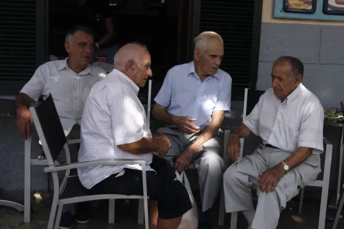 Framed Print : Group of men chatting at Pollensa Sunday market, Mallorca, Spain Framed Print : Group of men chatting at Pollensa Sunday market, Mallorca, Spain