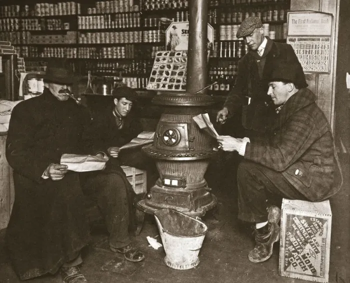 Framed Print : A group of men around a stove in a shop, USA, c1910 Framed Print : A group of men around a stove in a shop, USA, c1910