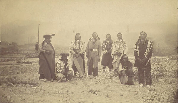 Group of Native American Men, Telegraph Poles in Background, 1880s-90s. Creator: Unknown